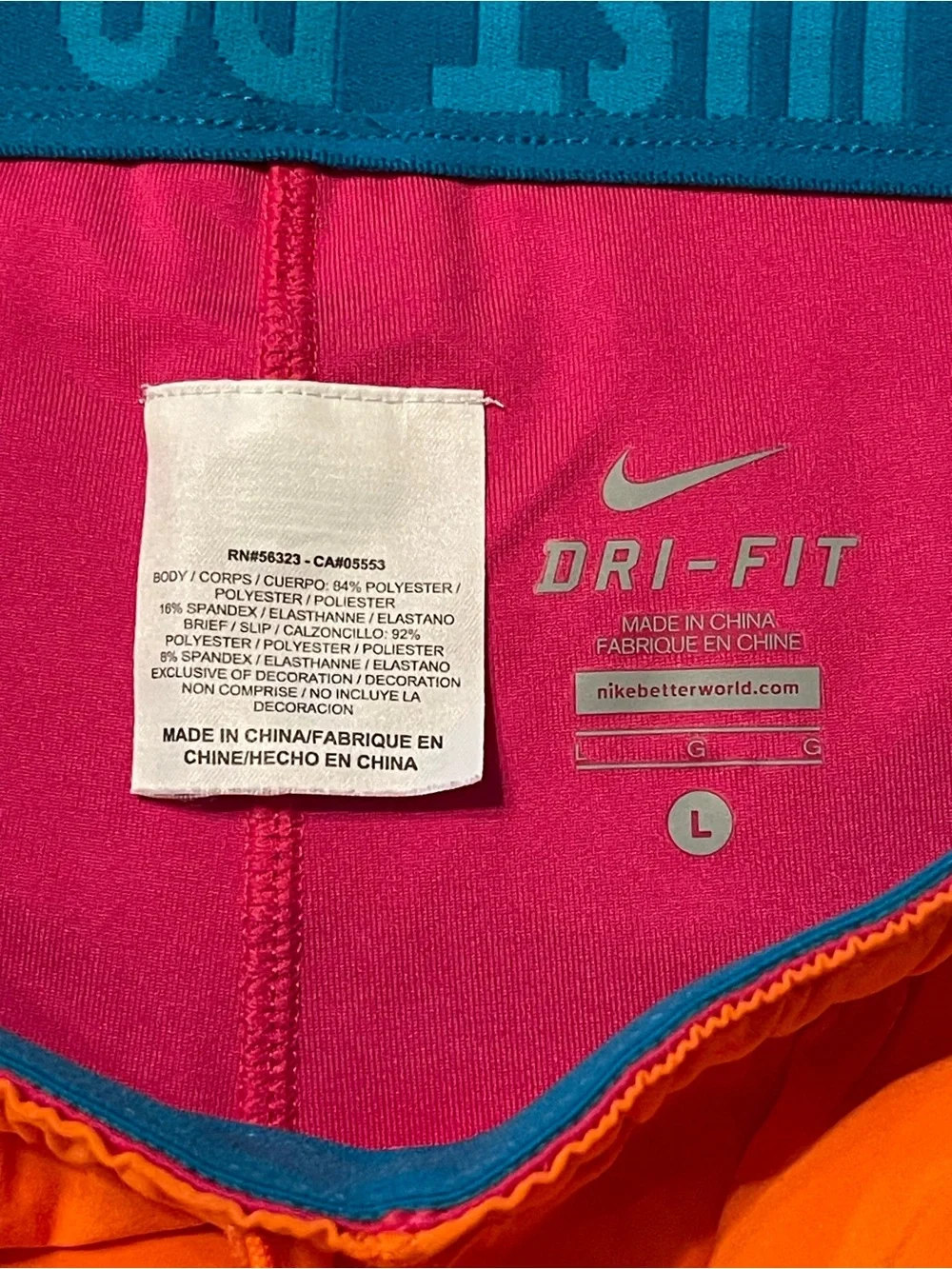 Nike Dri-FIT Women's Bright Orange Running Athletic Shorts with Pink Swoosh